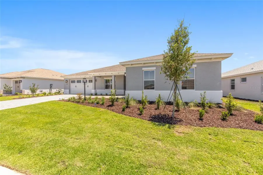 Front exterior of a new home in , Ocala, FL, highlighting curb appeal (Image 2). Front exterior of a new home in , Ocala, FL, highlighting curb appeal (Image 2).