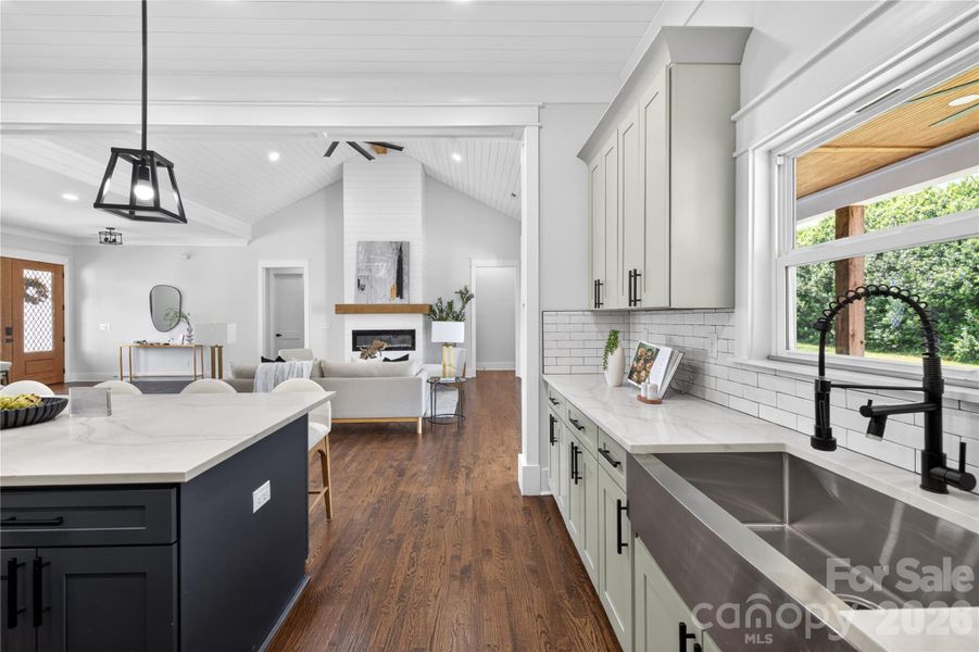 Cooking here wouldn’t even feel like a chore with this view into the living room and all the natural light coming in