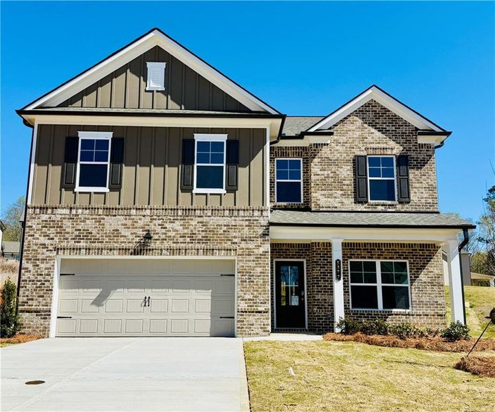 Front exterior of a new home in Ponderosa Farms Estates, Gainesville, GA, highlighting curb appeal (Image 2). Front exterior of a new home in Ponderosa Farms Estates, Gainesville, GA, highlighting curb appeal (Image 2).