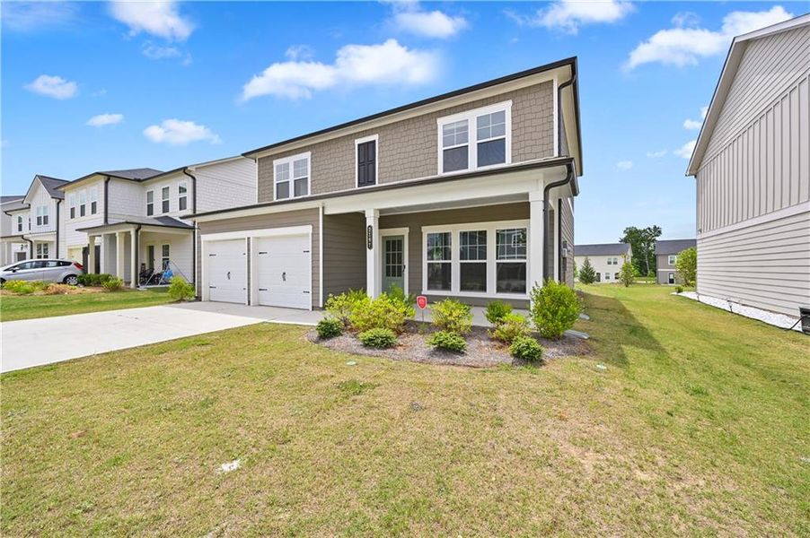 Front exterior of a new home in , Conyers, GA, highlighting curb appeal (Image 17).
