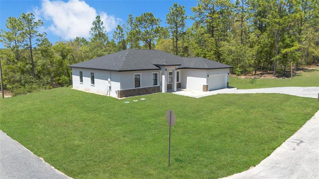 Front exterior of a new home in , Citrus Springs, FL, highlighting curb appeal (Image 25).