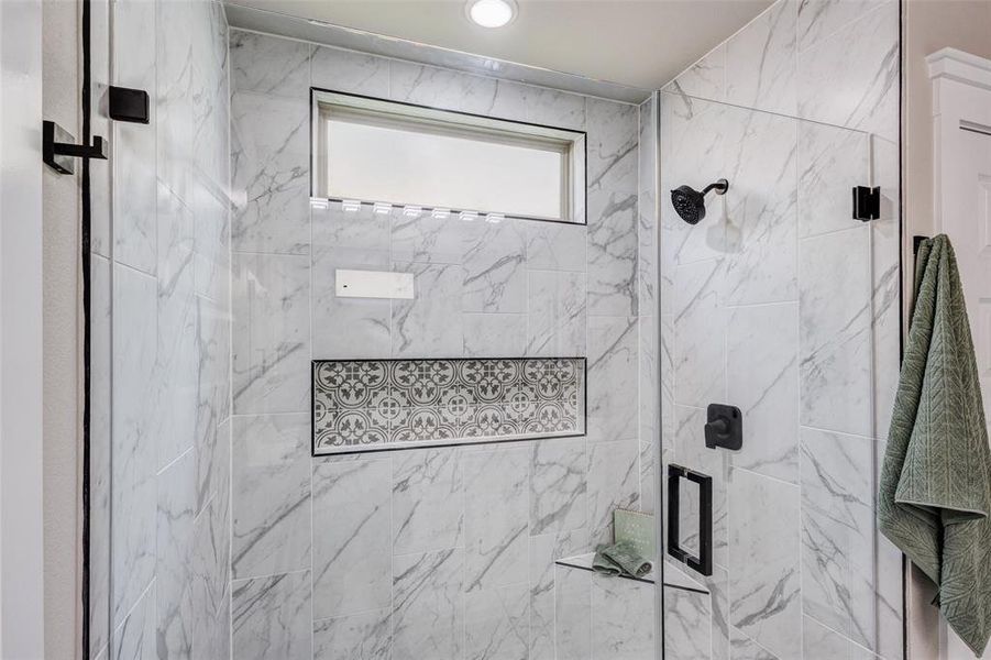 Bathroom with a over-sized walk in shower with custom tile