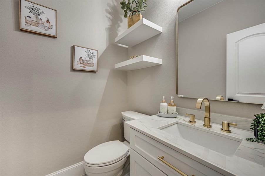 Bathroom with vanity and toilet