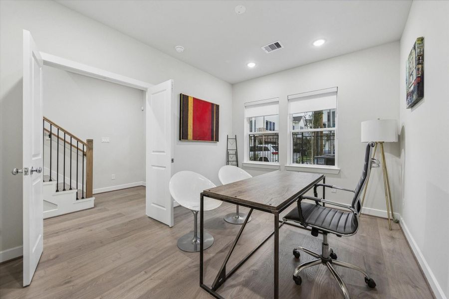 1st level bdrm (study) overlooking front green space & foyer. french doors. 1st level bdrm (study) overlooking front green space & foyer. french doors.