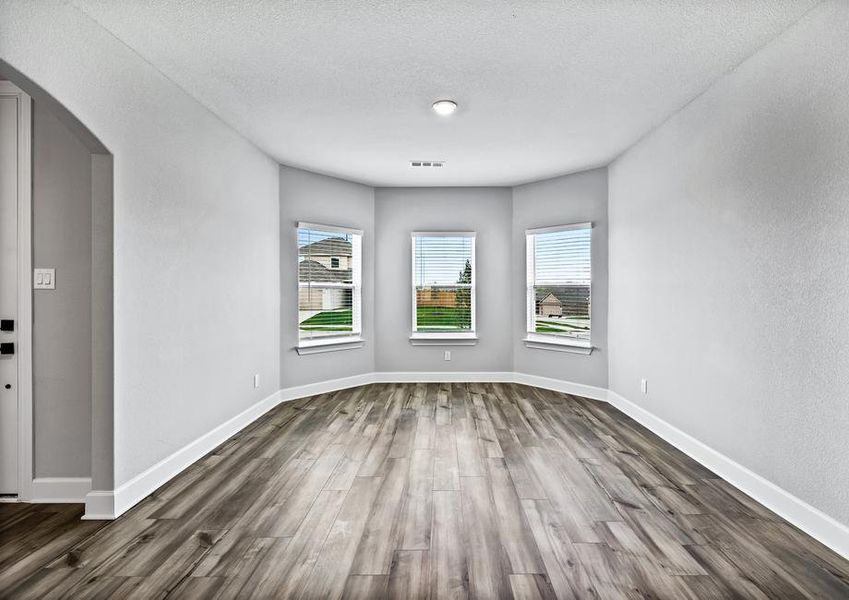 The large dining room has three large windows that let great natural light in!