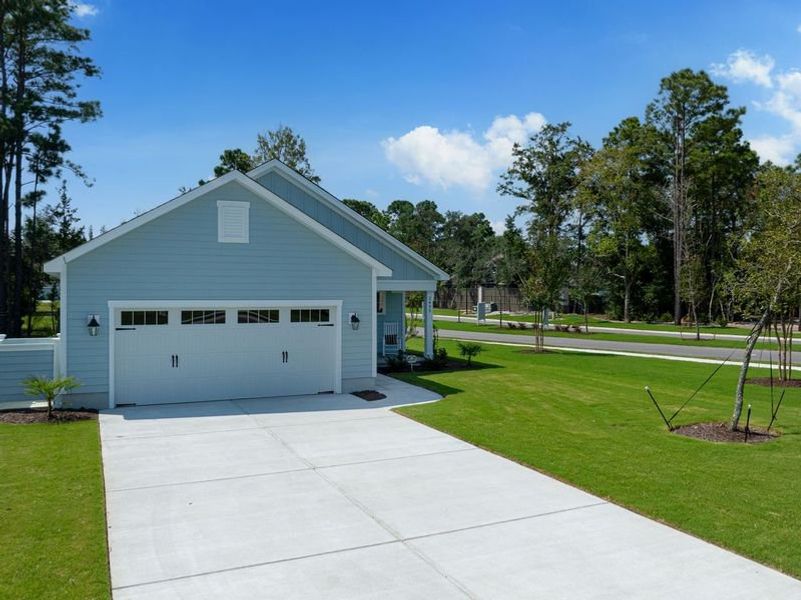 Front exterior of a new home in Osprey Landing, Southport, NC, highlighting curb appeal (Image 25).