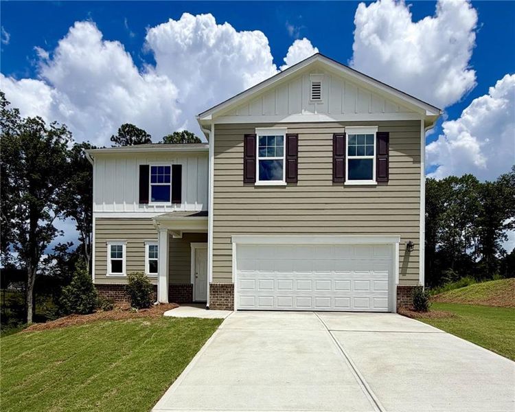 Front exterior of a new home in Mt. Tabor Ridge, Dallas, GA, highlighting curb appeal (Image 1). Front exterior of a new home in Mt. Tabor Ridge, Dallas, GA, highlighting curb appeal (Image 1).