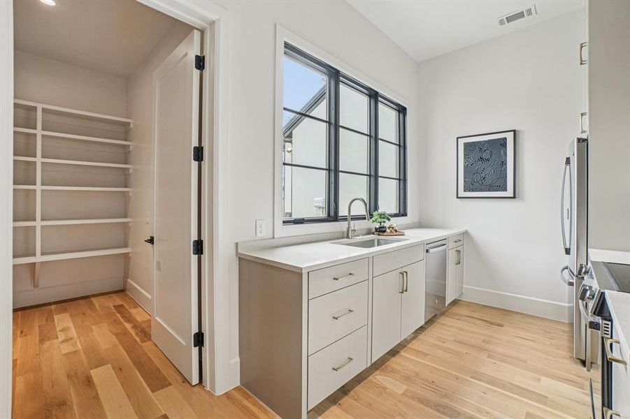 Prep kitchen and walk-in pantry Prep kitchen and walk-in pantry