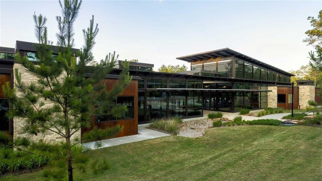 Front exterior of a new home in The Woodlands Hills 75', Willis, TX, highlighting curb appeal (Image 13).