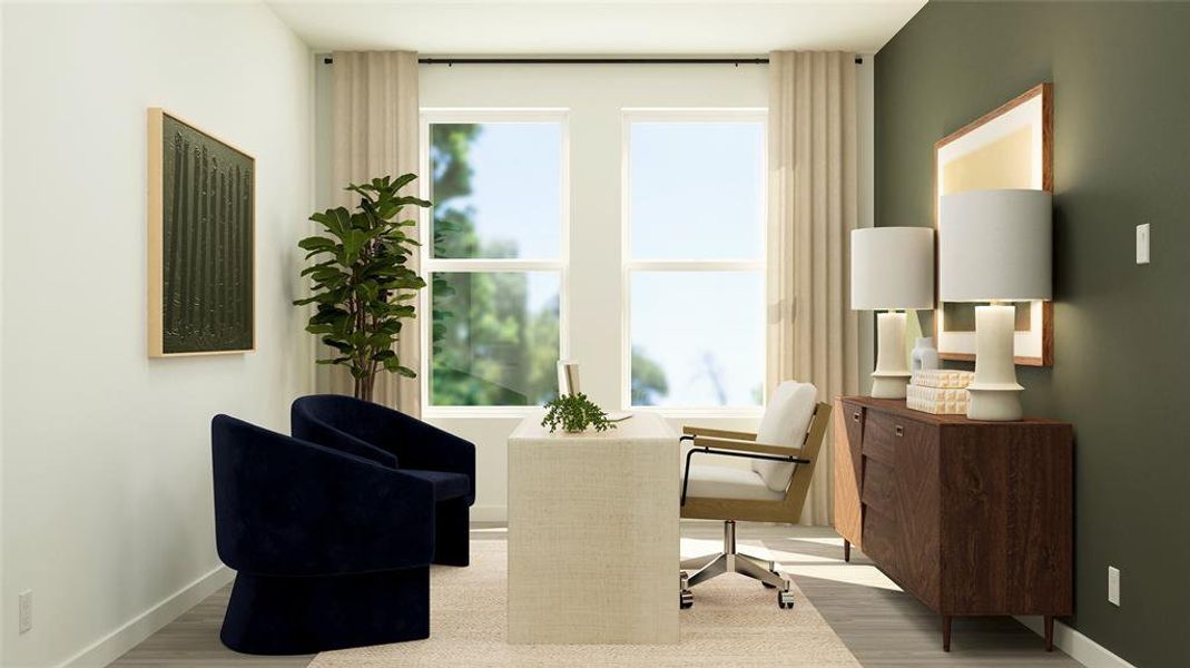 Living area featuring light wood finished floors and an office area