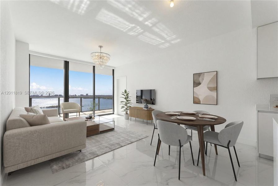 Spacious, sun-filled open-concept living area featuring floor-to-ceiling impact glass, high ceilings, and seamless flow to a deep waterfront balcony. Image is virtuallt staged.