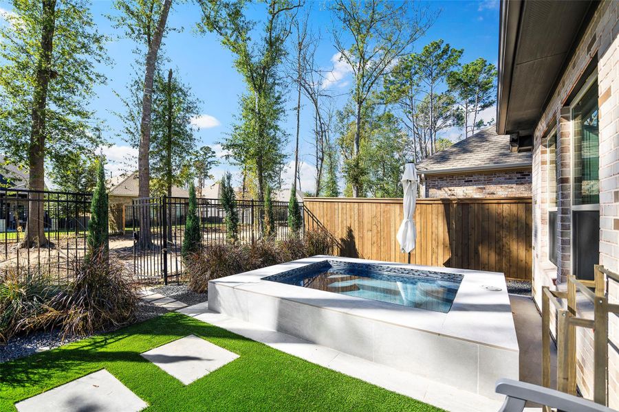 Exterior details and patio area of a home in The Highlands - Grove Collection, Porter (Image 25).