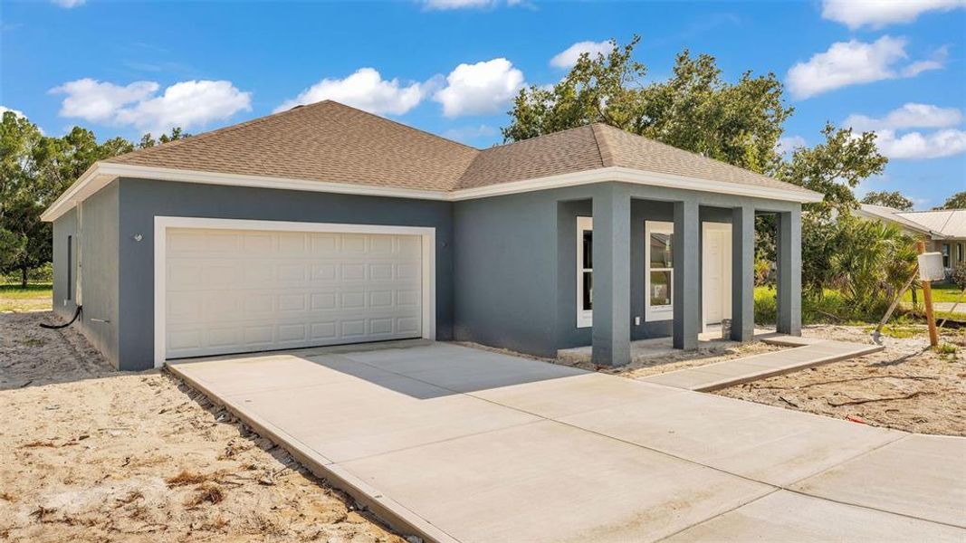 Front exterior of a new home in , Winter Haven, FL, highlighting curb appeal (Image 12).