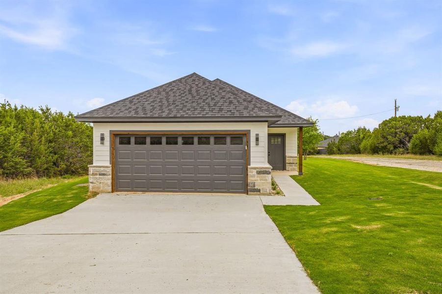 Front exterior of a new home in , Granbury, TX, highlighting curb appeal (Image 2). Front exterior of a new home in , Granbury, TX, highlighting curb appeal (Image 2).
