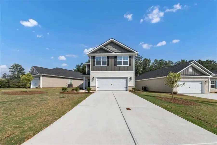 Front exterior of a new home in Canterbury Villas, Carrollton, GA, highlighting curb appeal (Image 20).
