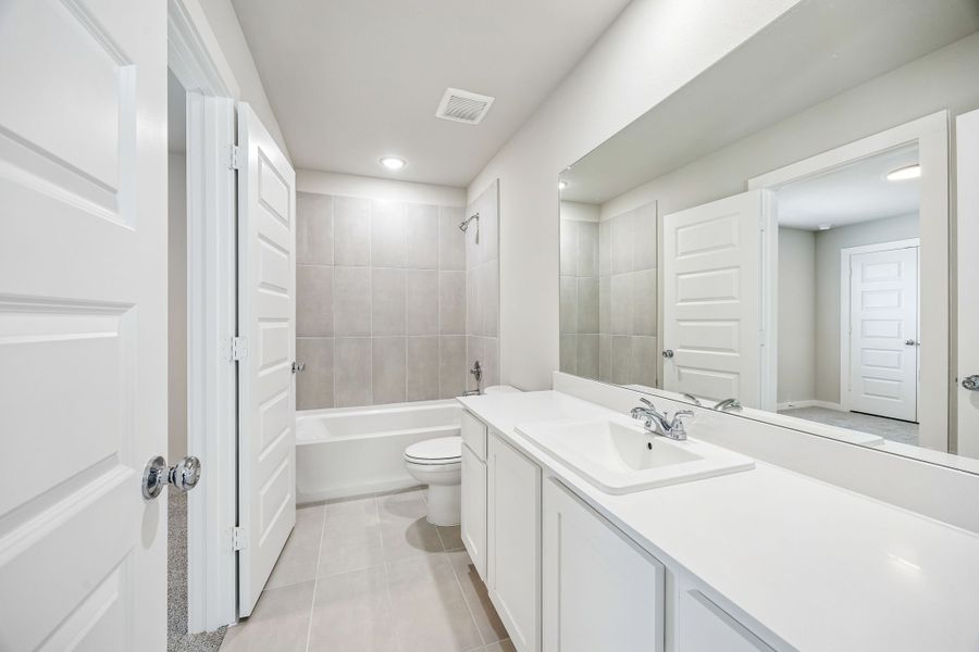 Bathroom in the Willow home plan by Trophy Signature Homes – REPRESENTATIVE PHOTO