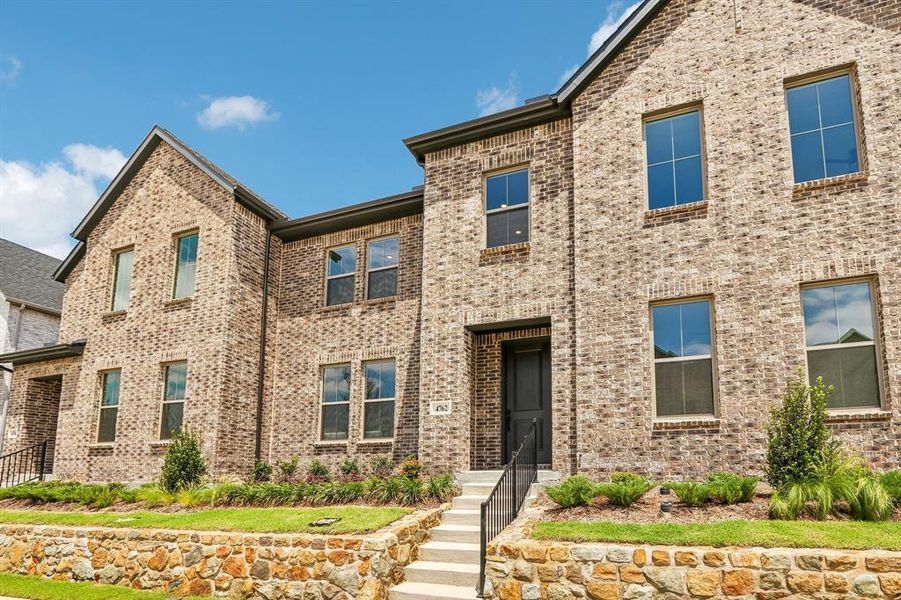 Beautiful brick with striking trim and lovely stone retaining wall create fantastic curb appeal for this dream home! Beautiful brick with striking trim and lovely stone retaining wall create fantastic curb appeal for this dream home!