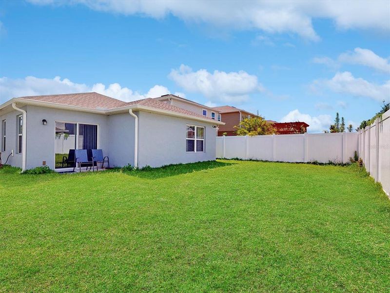 Front exterior of a new home in , Davenport, FL, highlighting curb appeal (Image 21).