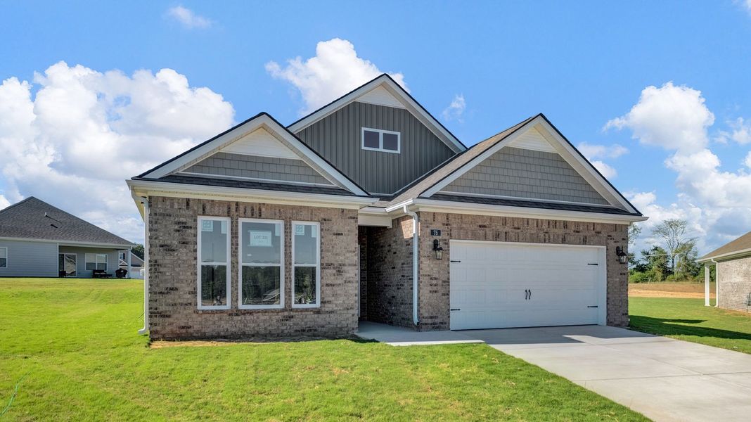 Front exterior of a new home in Riverwood Gardens, Oakland, TN, highlighting curb appeal (Image 2).