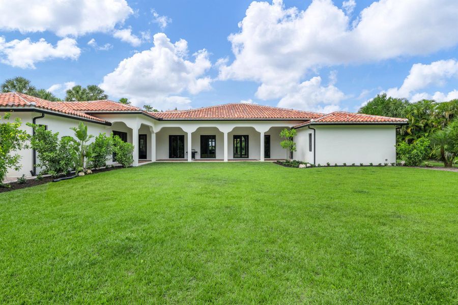 Front exterior of a new home in , Wellington, FL, highlighting curb appeal (Image 22).