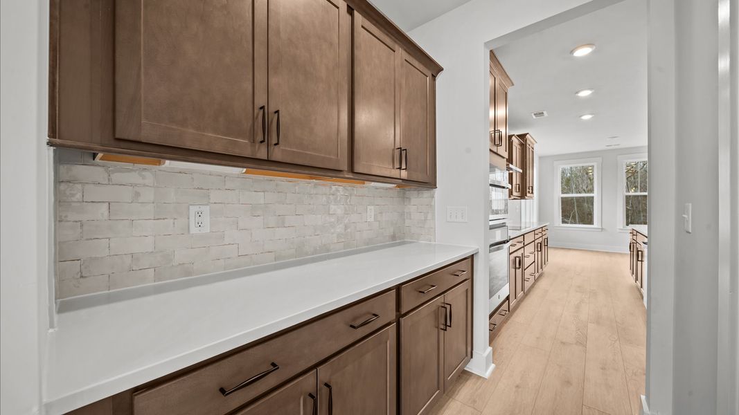 A beautifully designed butler’s pantry that keeps your kitchen clutter free and entertaining effortless