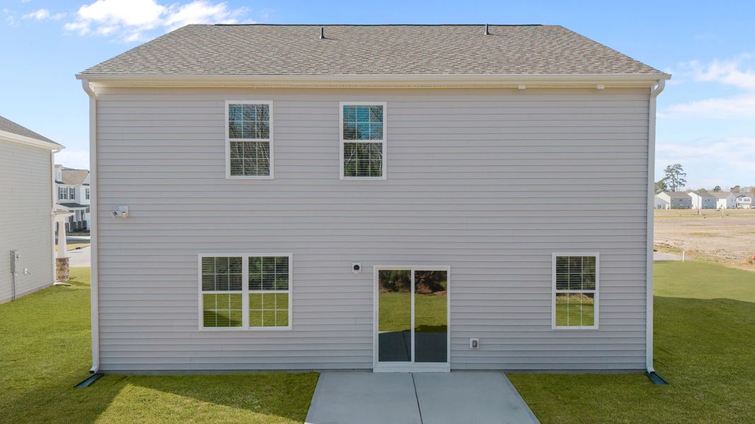 Exterior details and patio area of a home in Ridgewood Farms, Winterville (Image 13).