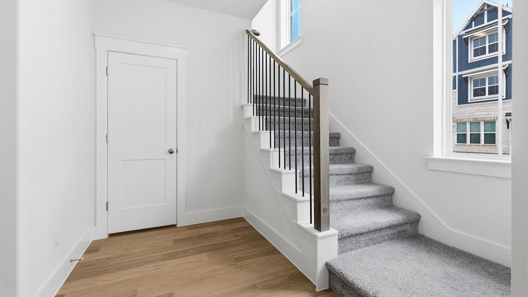 Furnished interior view inside a new home in Collin Creek, Plano (Image 8).