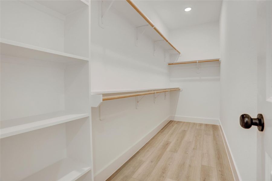 The primary bedroom has an enormous 4'6"x13' closet with built ins.