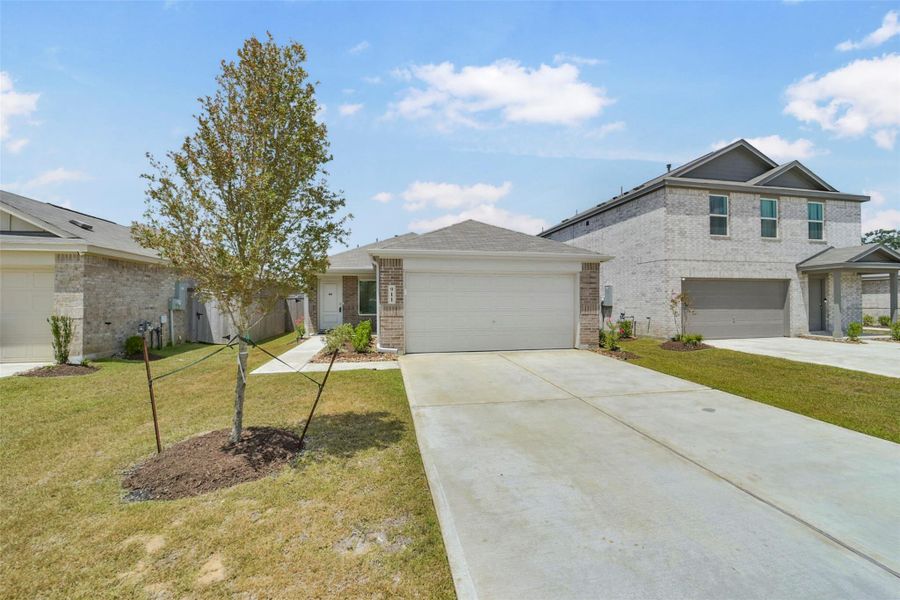 Front exterior of a new home in Sila, Huffman, TX, highlighting curb appeal (Image 2). Front exterior of a new home in Sila, Huffman, TX, highlighting curb appeal (Image 2).