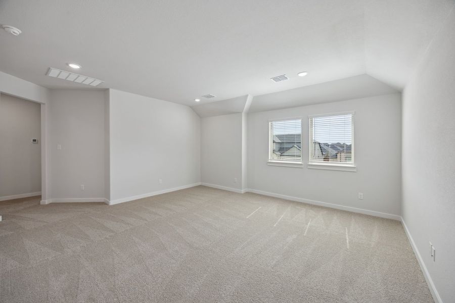 Game room in the Masters home plan by Trophy Signature Homes – REPRESENTATIVE PHOTO