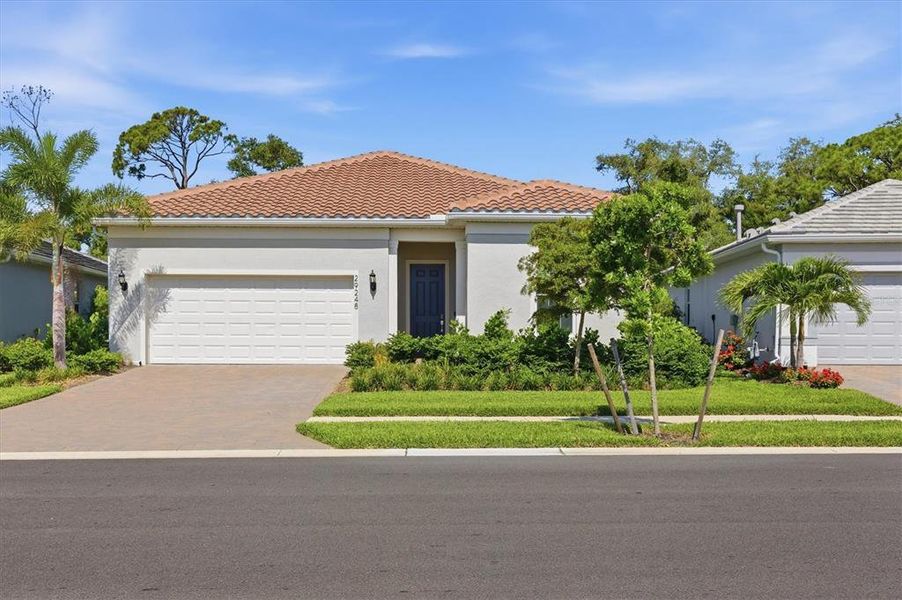 Front exterior of a new home in , Englewood, FL, highlighting curb appeal (Image 23). Front exterior of a new home in , Englewood, FL, highlighting curb appeal (Image 23).