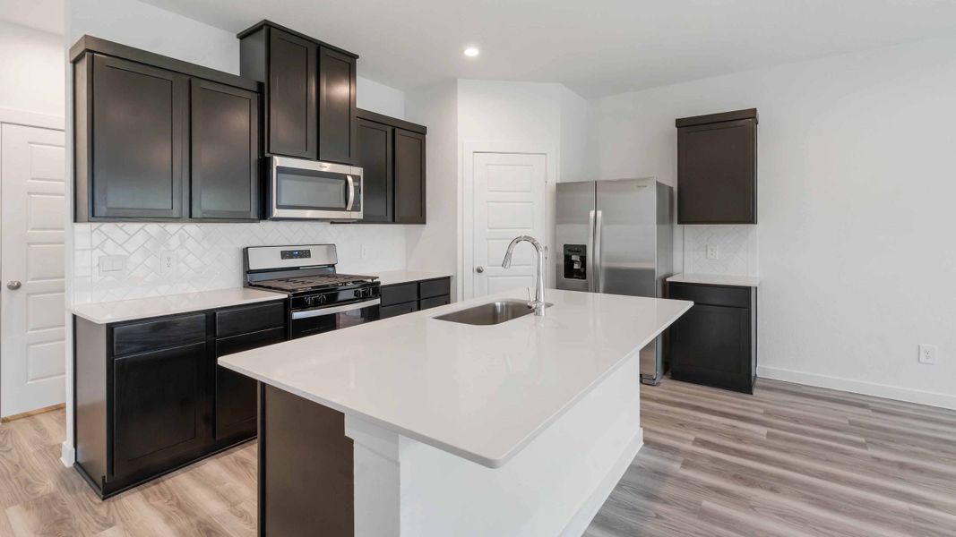 Representative furnished interior of a home built from the Iris by D.R. Horton in City Gate North, Houston (Image 6).
