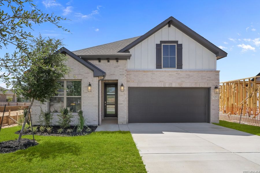 Front exterior of a new home in Davis Ranch, San Antonio, TX, highlighting curb appeal (Image 27).