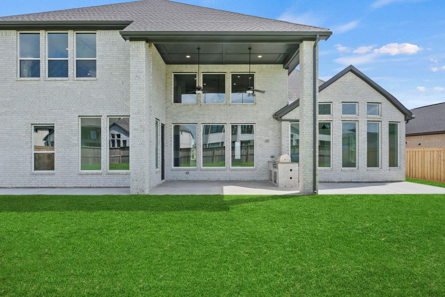 Exterior details and patio area of a home in Dunham Pointe, Cypress (Image 25).