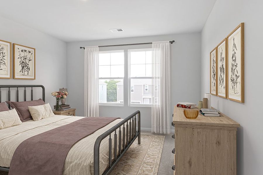 A bedroom with a bed and a window. A bedroom with a bed and a window.