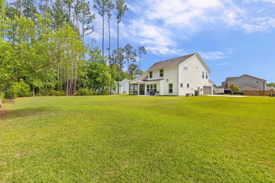 Exterior details and patio area of a home in , Johns Island (Image 26).