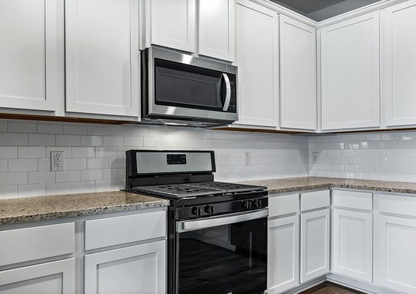 The kitchen of the Michigan floor plan has a stunning backsplash!