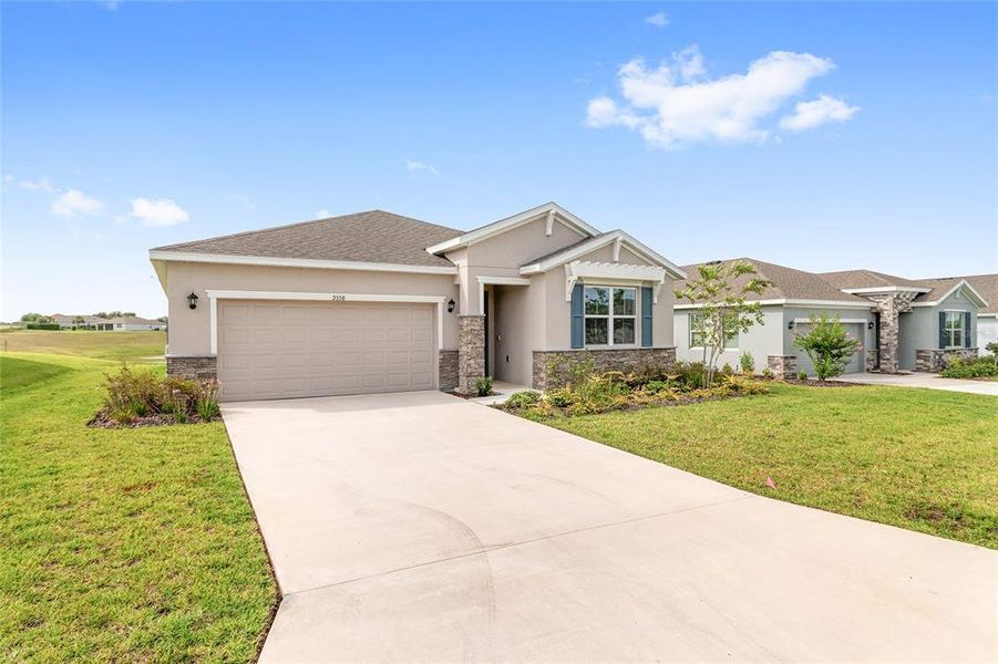 Front exterior of a new home in JB Ranch, Ocala, FL, highlighting curb appeal (Image 2). Front exterior of a new home in JB Ranch, Ocala, FL, highlighting curb appeal (Image 2).