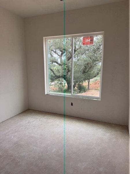 Bright interior space featuring a large window, providing natural illumination