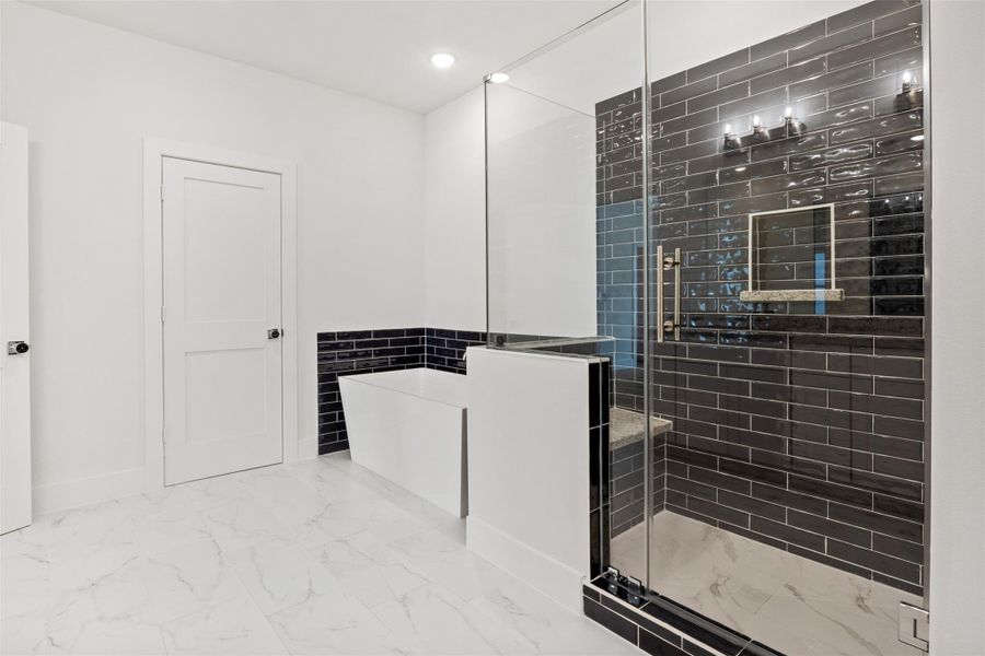 Step into your spacious walk-in shower with a comfortable seat or indulge in a relaxing bubble bath. In this retreat, the possibilities are endless! Step into your spacious walk-in shower with a comfortable seat or indulge in a relaxing bubble bath. In this retreat, the possibilities are endless!