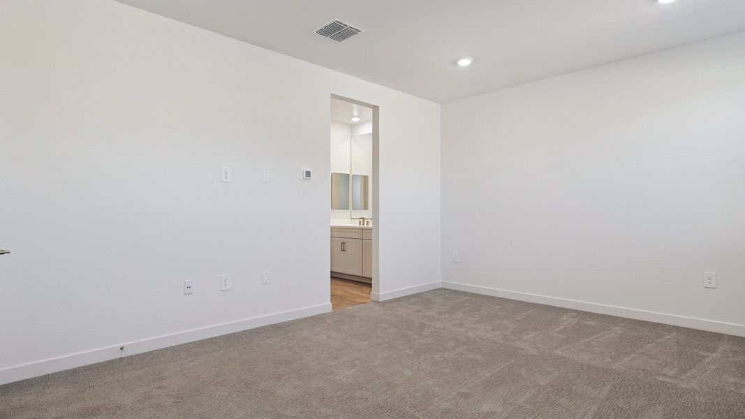Representative unfurnished interior of a home built from the Hayden by D.R. Horton in The Ridge at Stone Butte, Phoenix (Image 36).