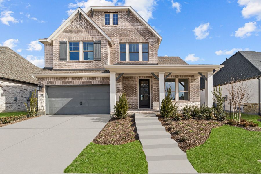 Representative exterior photo of a completed home built from the The Clairmont by David Weekley Homes in Treeline, Justin, TX (Image 1). Representative exterior photo of a completed home built from the The Clairmont by David Weekley Homes in Treeline, Justin, TX (Image 1).