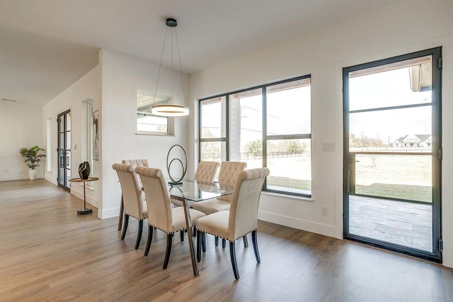 Dining room featuring light wood-style flooring Dining room featuring light wood-style flooring