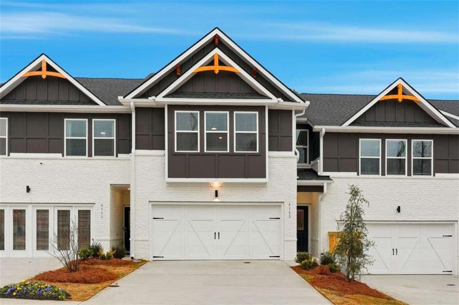 Front exterior of a new home in Concord Oaks, Powder Springs, GA, highlighting curb appeal (Image 22). Front exterior of a new home in Concord Oaks, Powder Springs, GA, highlighting curb appeal (Image 22).