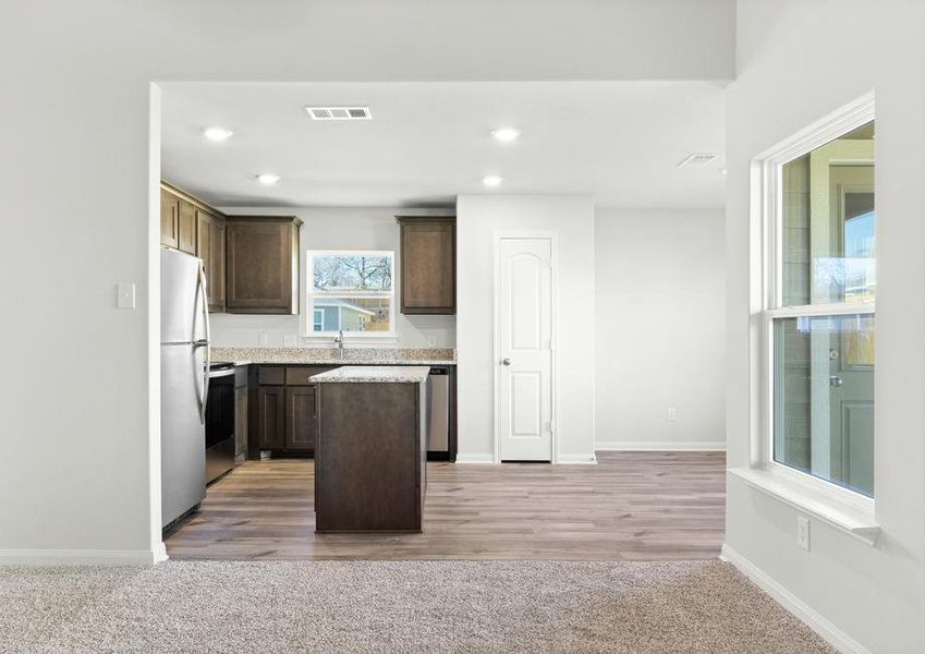 The kitchen of the Blanco sits right off of the family room.