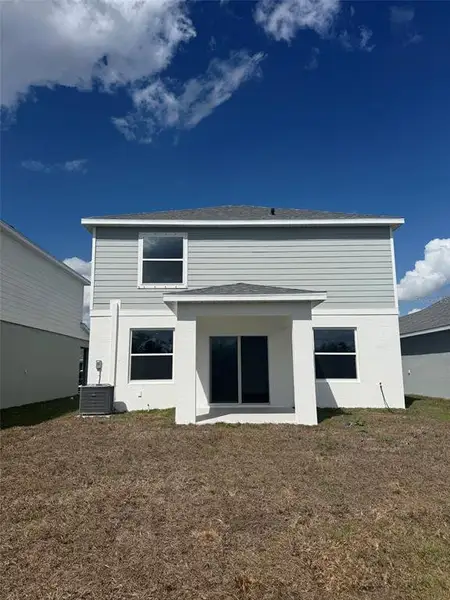 Exterior details and patio area of a home in Broadleaf, Parrish (Image 3).