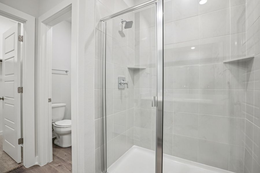 A bathroom with a glass shower.