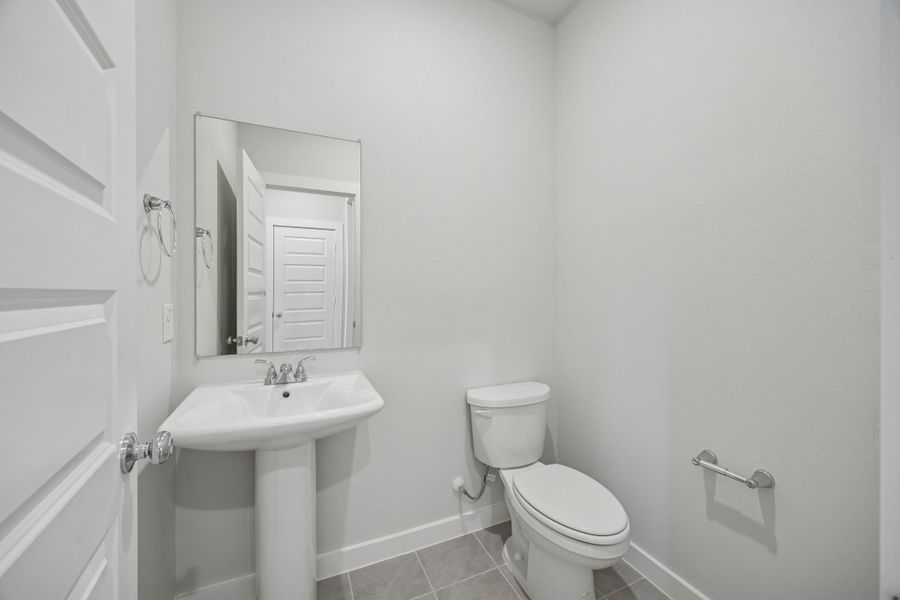 Bathroom in the Oak II home plan by Trophy Signature Homes – REPRESENTATIVE PHOTO