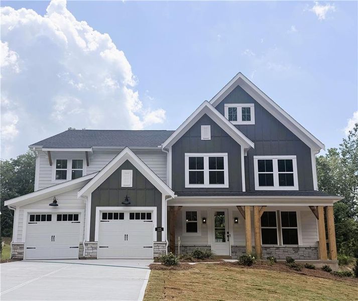 Front exterior of a new home in Woodberry, Canton, GA, highlighting curb appeal (Image 1). Front exterior of a new home in Woodberry, Canton, GA, highlighting curb appeal (Image 1).
