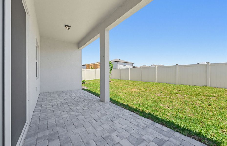 Exterior details and patio area of a home in Vida's Way, Wesley Chapel (Image 3).